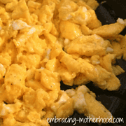 perfect scrambled eggs cooked in a cast iron skillet